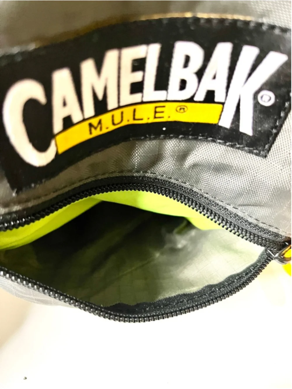 CamelBak M.U.L.E. hydration backpack features distinct yellow trim